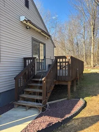 a view of house with a yard
