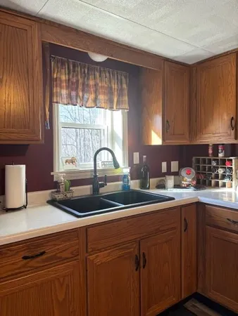 a kitchen with a sink and cabinets