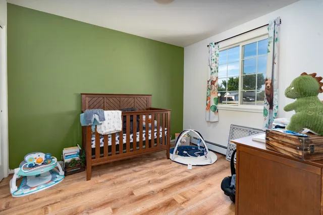 a bedroom with furniture and a window