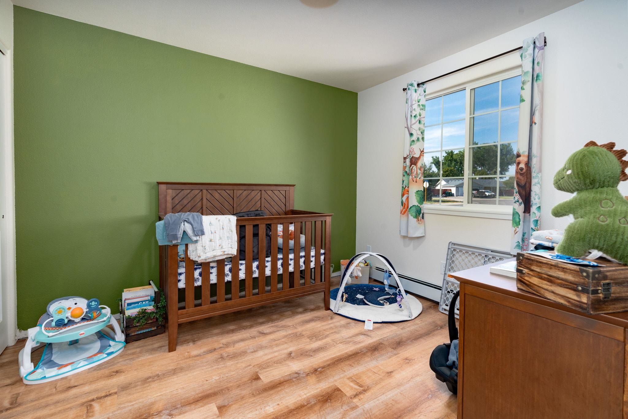 1300 Powell Street Fruita, CO 81521 - Photo 13 of 25 a bedroom with furniture and a window