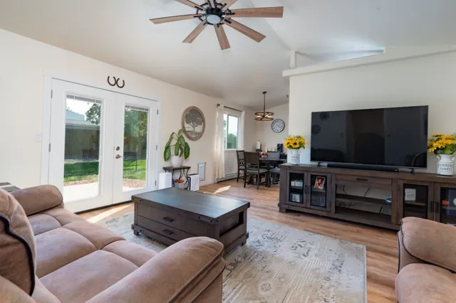 a living room with furniture and a flat screen tv