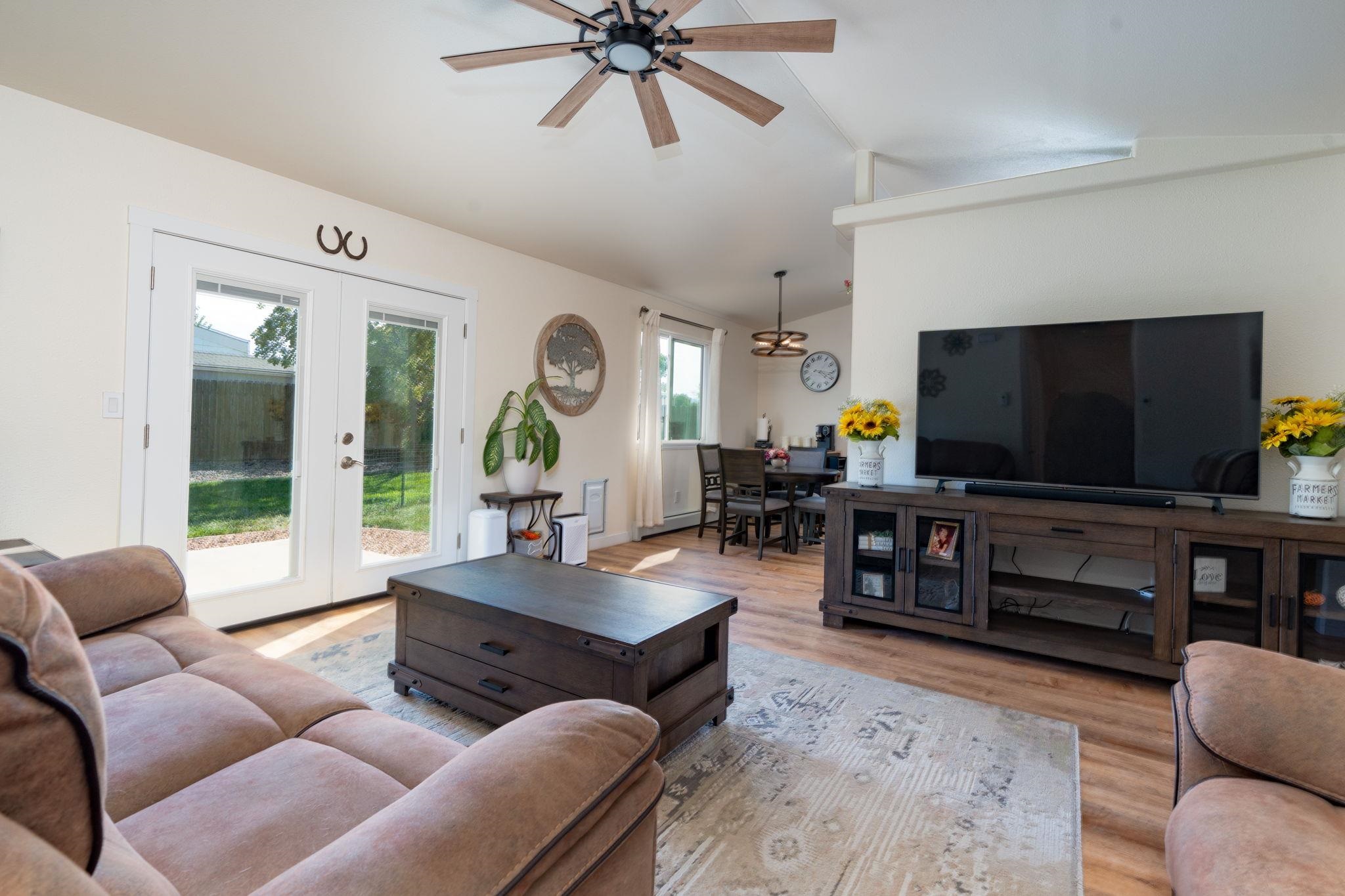 1300 Powell Street Fruita, CO 81521 - Photo 19 of 25 a living room with furniture and a flat screen tv