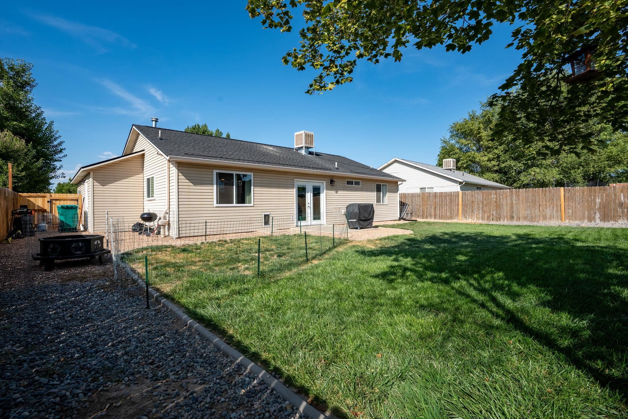 1300 Powell Street Fruita, CO 81521 - Photo 23 of 25 a view of a house with a backyard