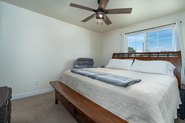 a bedroom with a bed and window