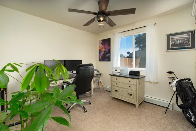 a view of a workspace with furniture