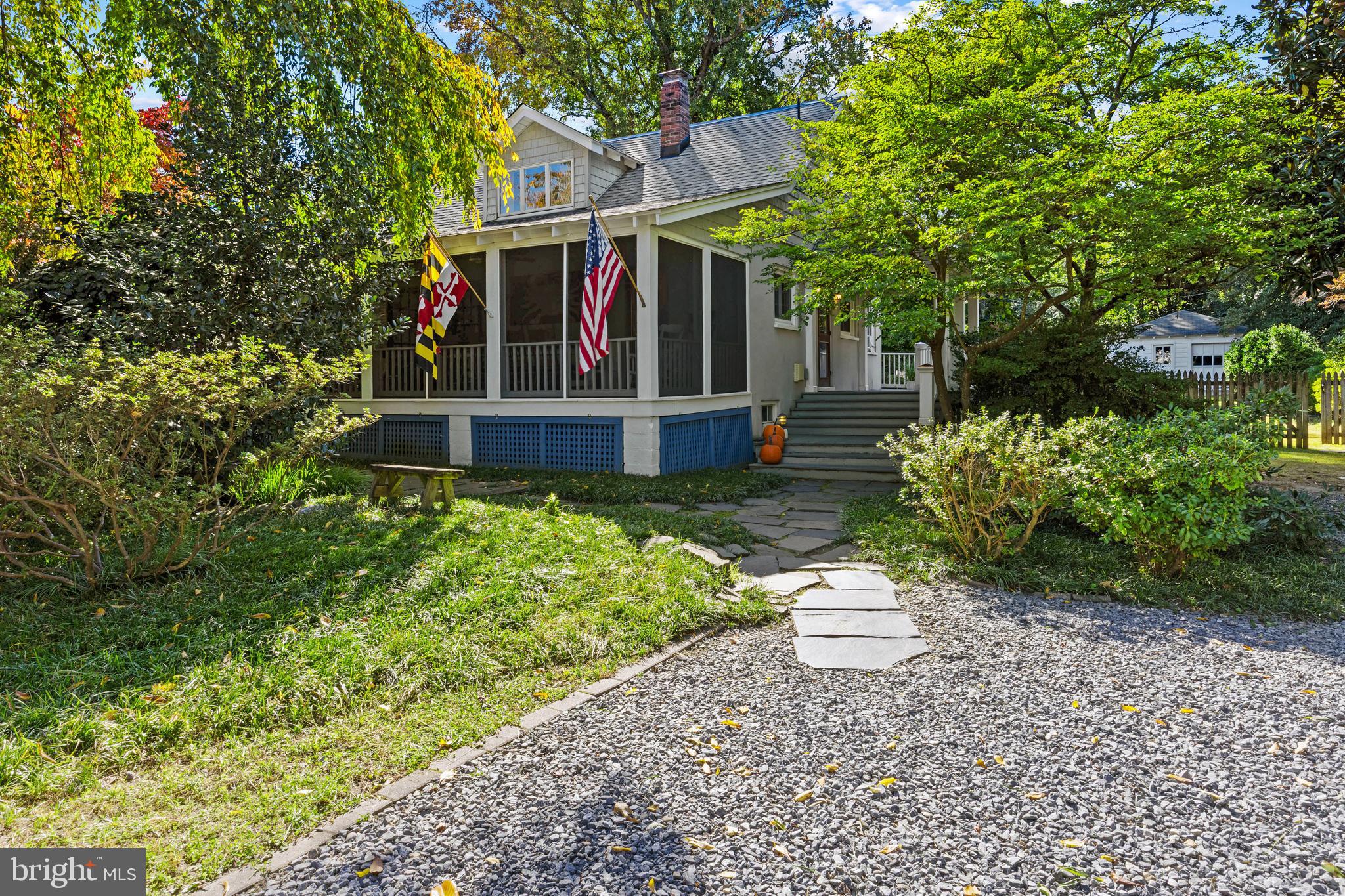 a view of a patio with table and chairs and potted plants