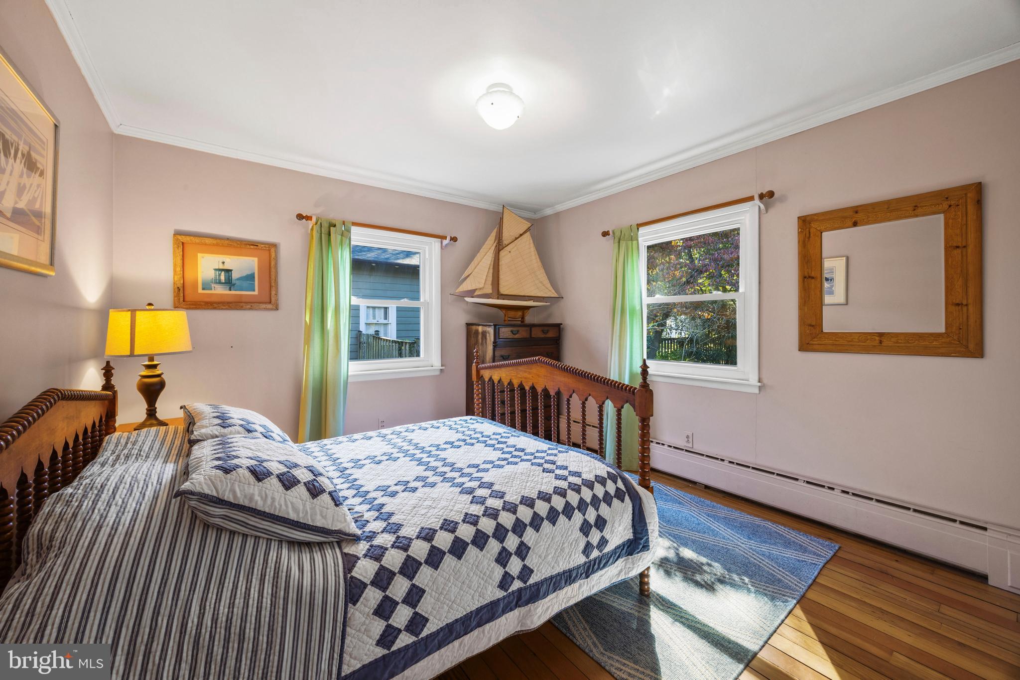30 Decatur Avenue Annapolis, MD 21403 - Photo 14 of 38 a bedroom with a bed and wooden floor