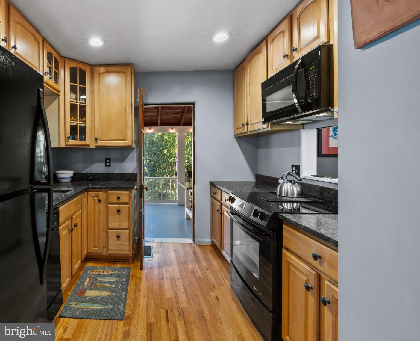 30 Decatur Avenue Annapolis, MD 21403 - Photo 5 of 38 a kitchen with stainless steel appliances granite countertop a stove top oven a sink dishwasher a refrigerator and cabinets with wooden floor