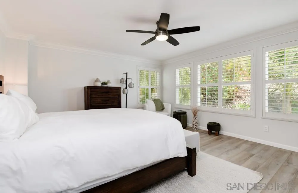 4734 Crater Rim Road Carlsbad, CA 92010 - Photo 19 of 31 a bedroom with a bed and a large window