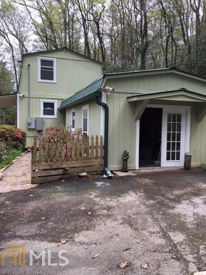 353 Sims Way, Unit 8 Rabun Gap, GA 30568 - Photo 1 of 1 a view of a house with a yard and garage