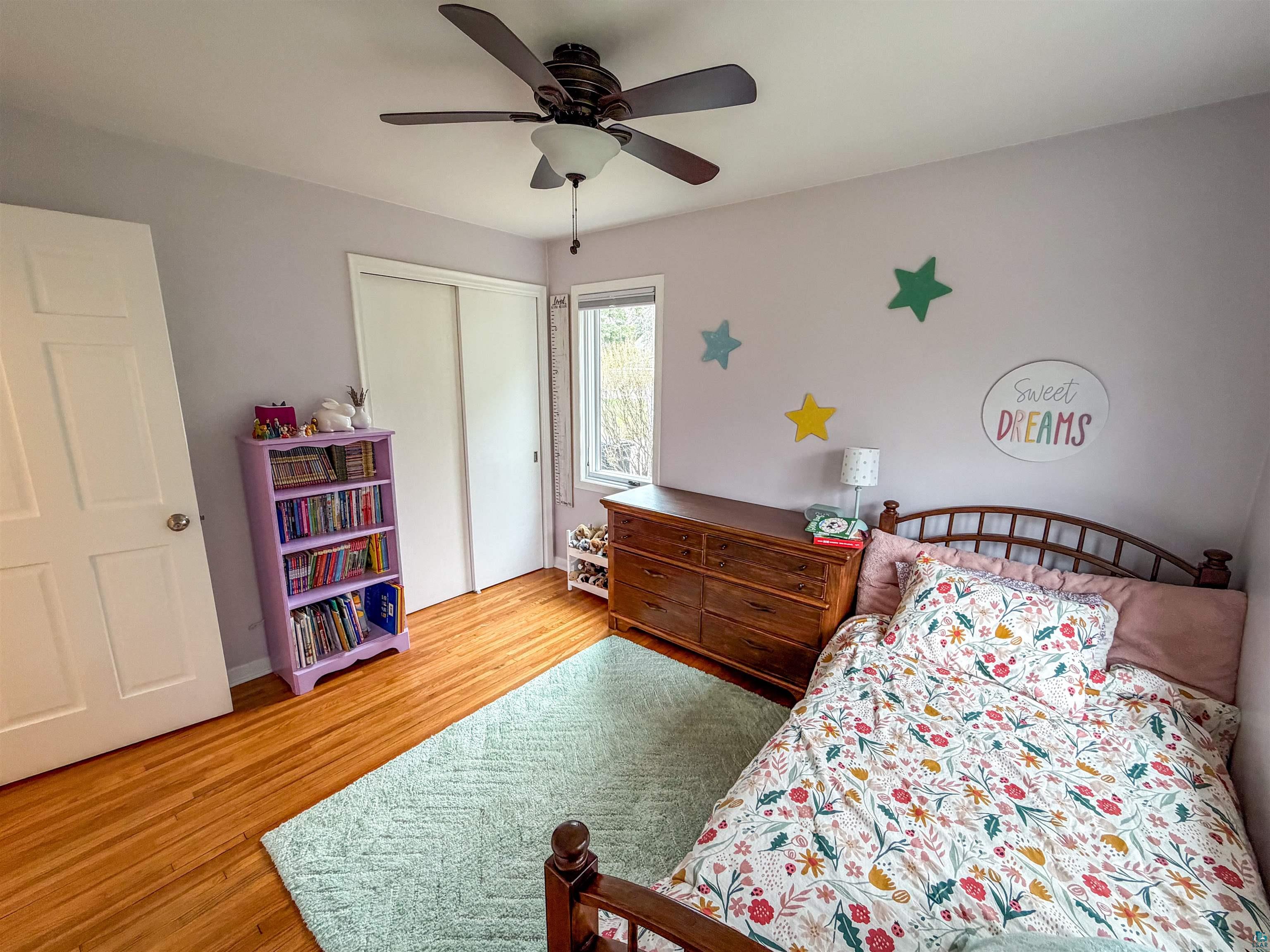 3704 Greysolon Road Duluth, MN 55804 - Photo 15 of 51 Bedroom featuring wood-finish flooring and a ceiling fan with integrated lighting