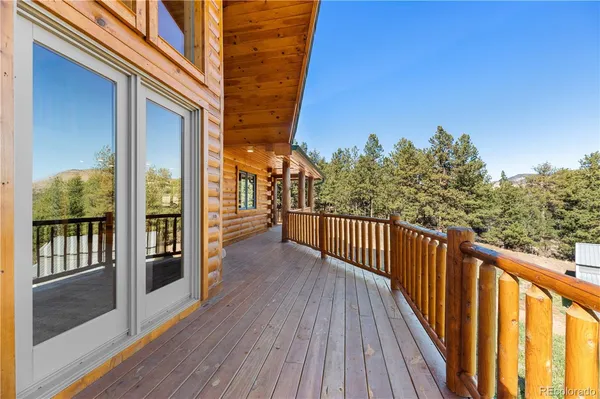a view of a balcony with wooden floor