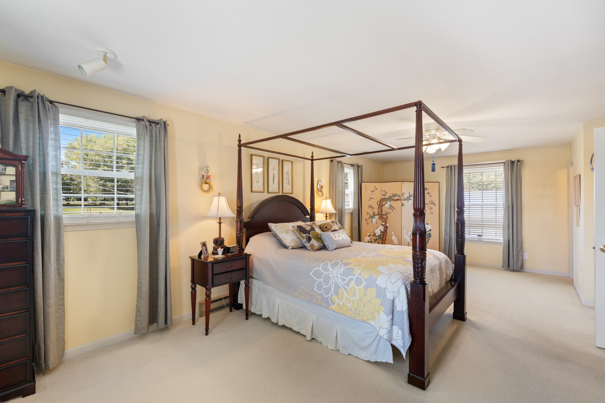 10779 North Tidwell Road Bon Aqua, TN 37025 - Photo 14 of 46 a bedroom with a bed and a mirror