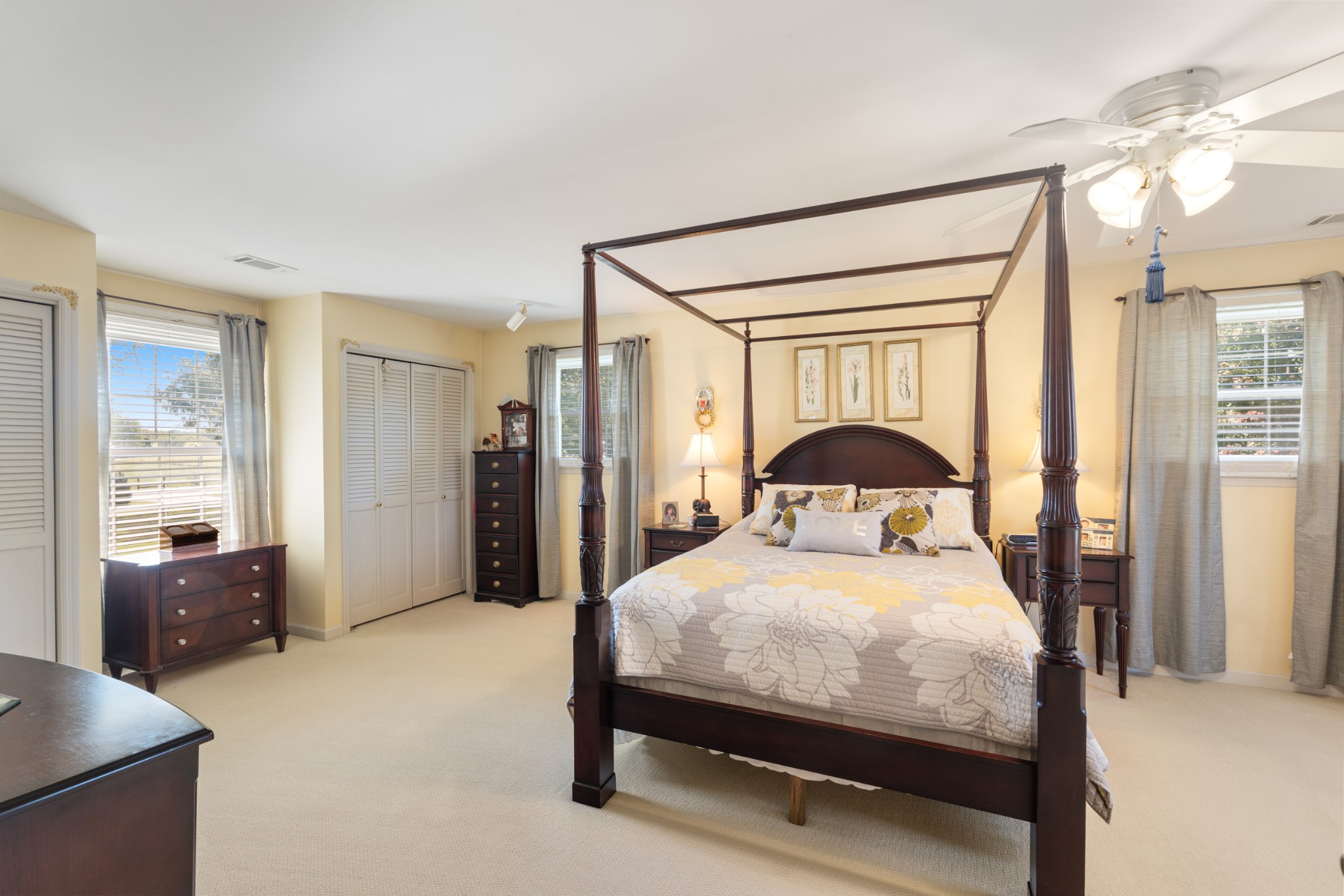 10779 North Tidwell Road Bon Aqua, TN 37025 - Photo 15 of 46 a bedroom with a bed and a large mirror with window