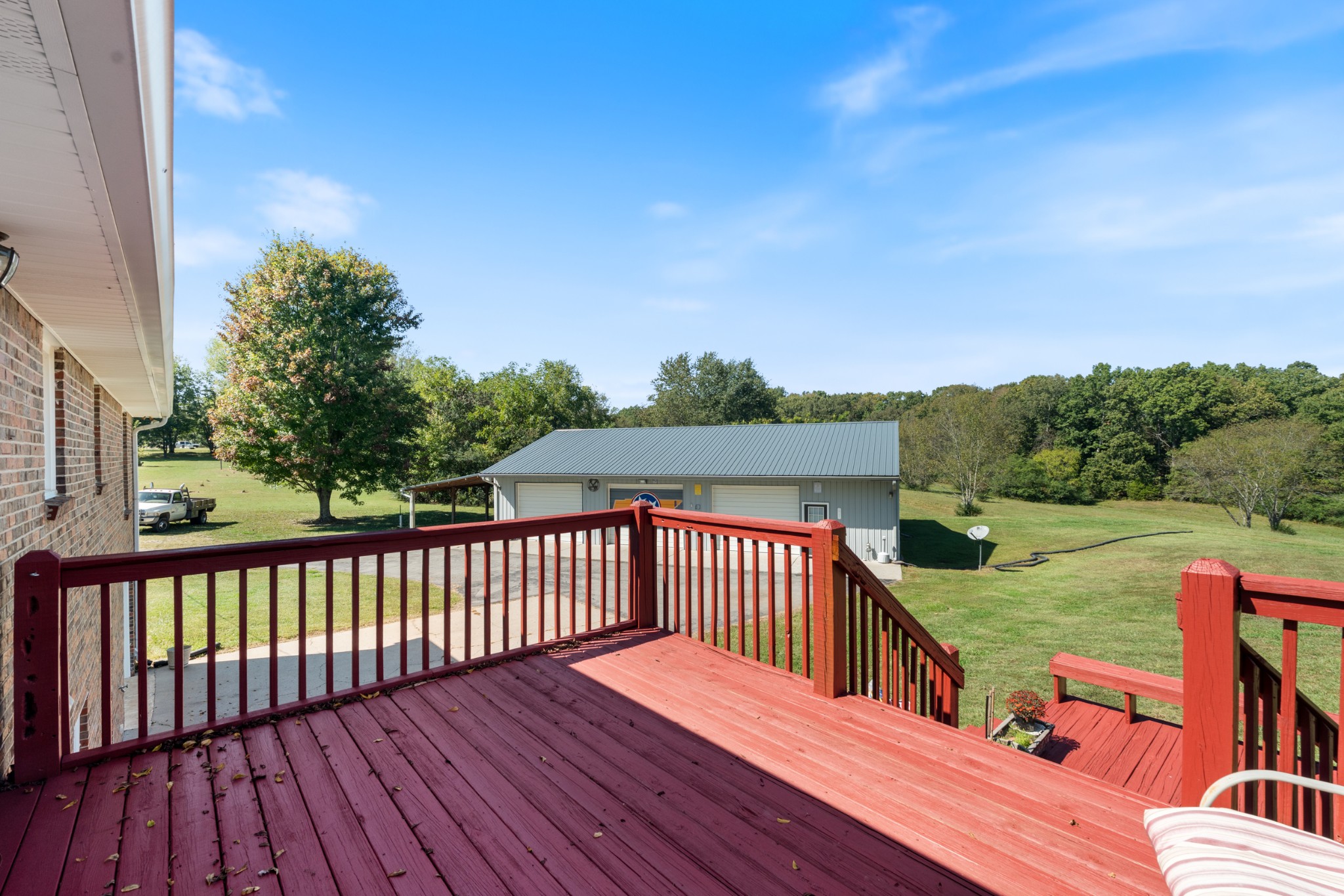 10779 North Tidwell Road Bon Aqua, TN 37025 - Photo 15 of 44 a view of a wooden deck with a yard