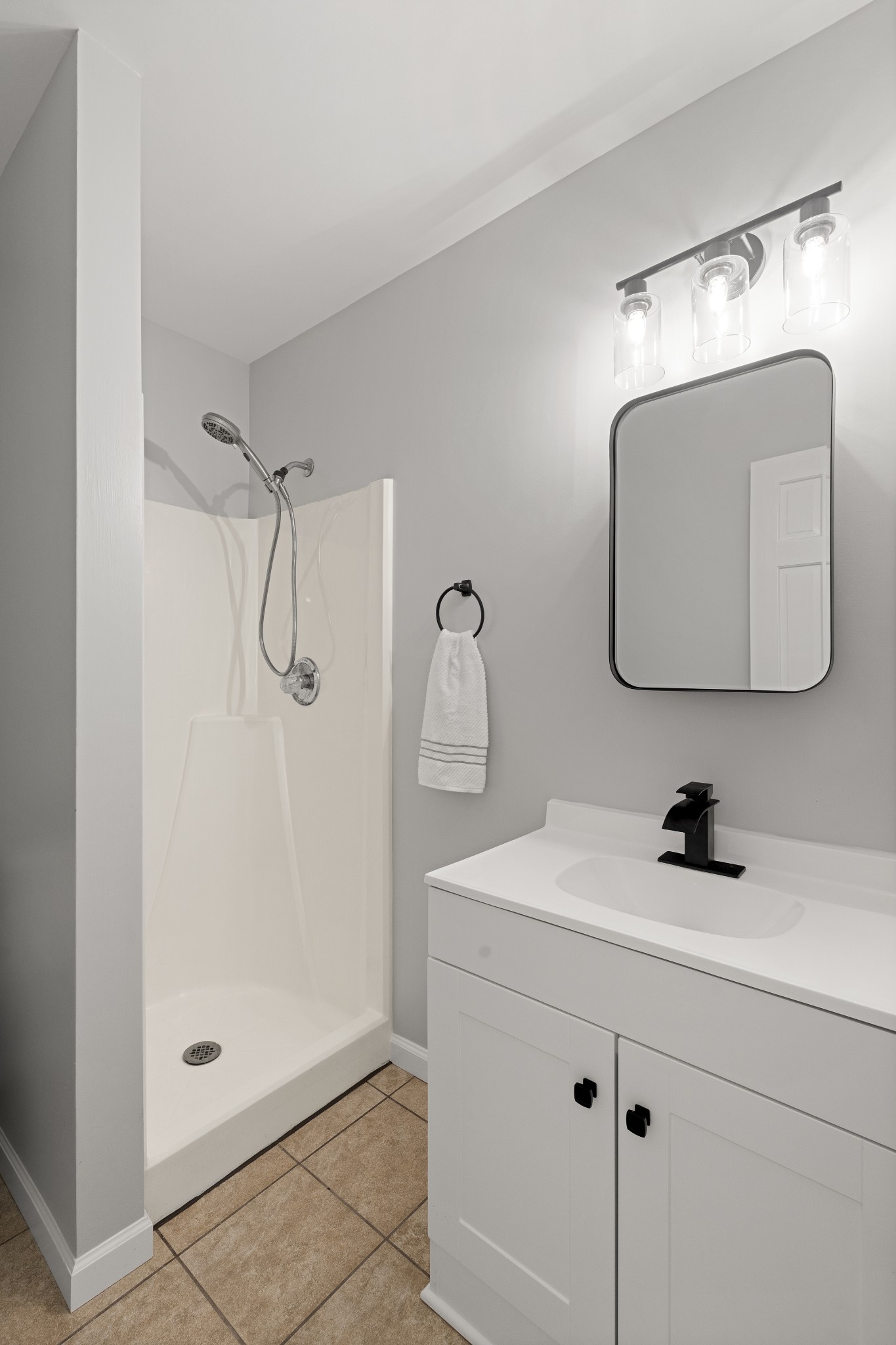 10779 North Tidwell Road Bon Aqua, TN 37025 - Photo 16 of 46 a bathroom with a shower sink and mirror