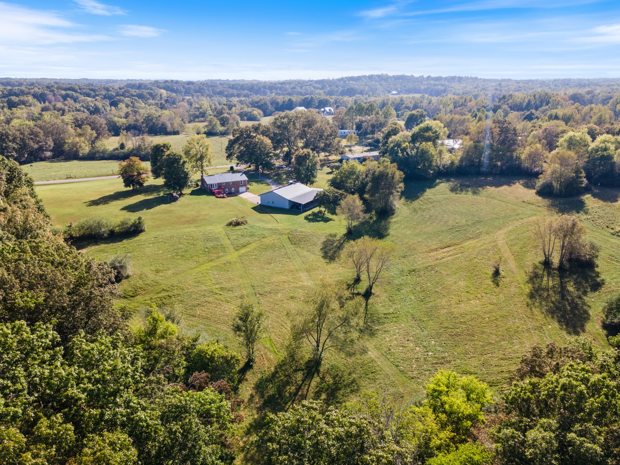 10779 North Tidwell Road Bon Aqua, TN 37025 - Photo 2 of 46 an aerial view of residential houses with outdoor space