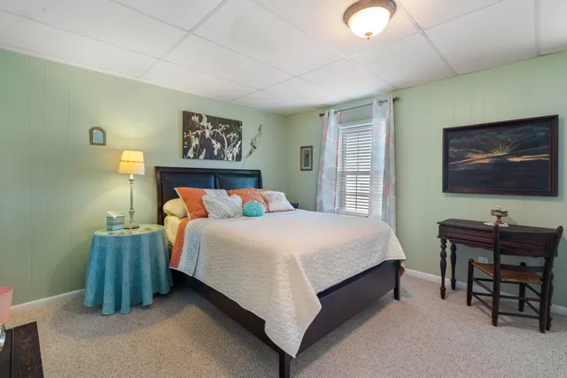 a bedroom with a bed and a desk