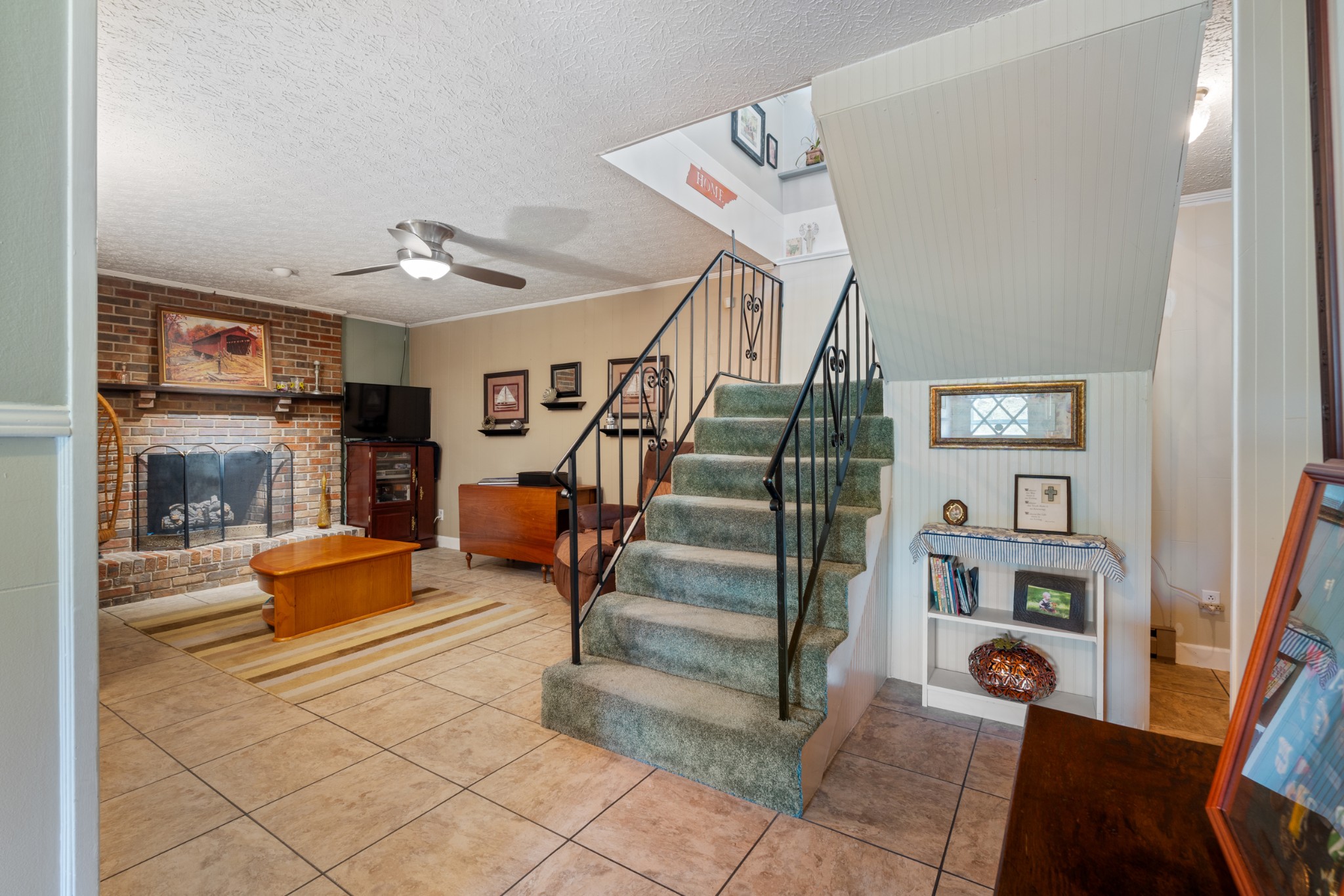 10779 North Tidwell Road Bon Aqua, TN 37025 - Photo 25 of 44 a bedroom with furniture and wooden floors