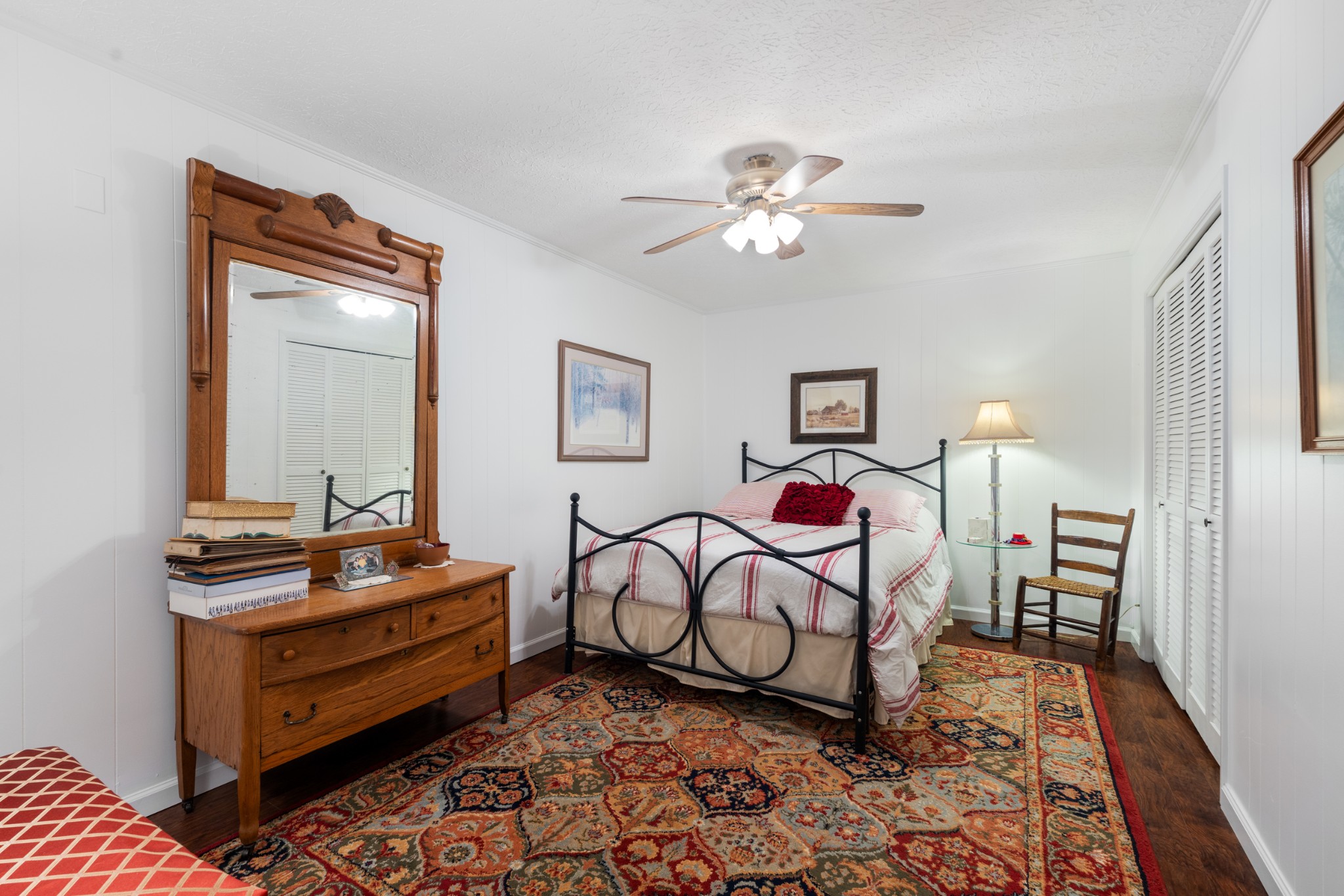 10779 North Tidwell Road Bon Aqua, TN 37025 - Photo 28 of 46 a bedroom with furniture and wooden floor