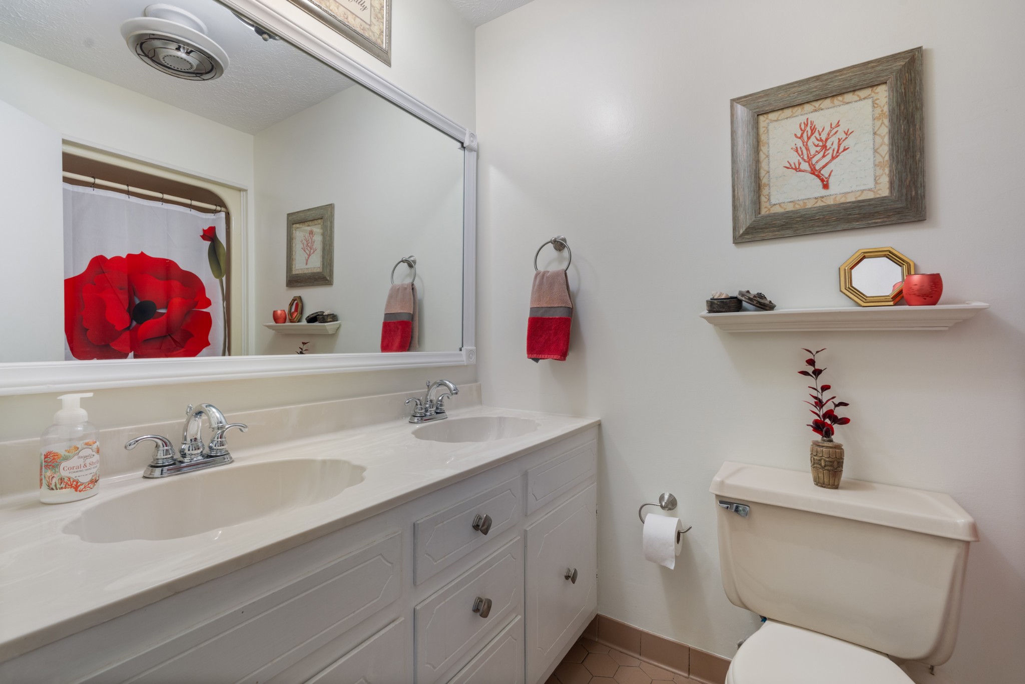 10779 North Tidwell Road Bon Aqua, TN 37025 - Photo 29 of 44 a bathroom with a sink mirror and toilet