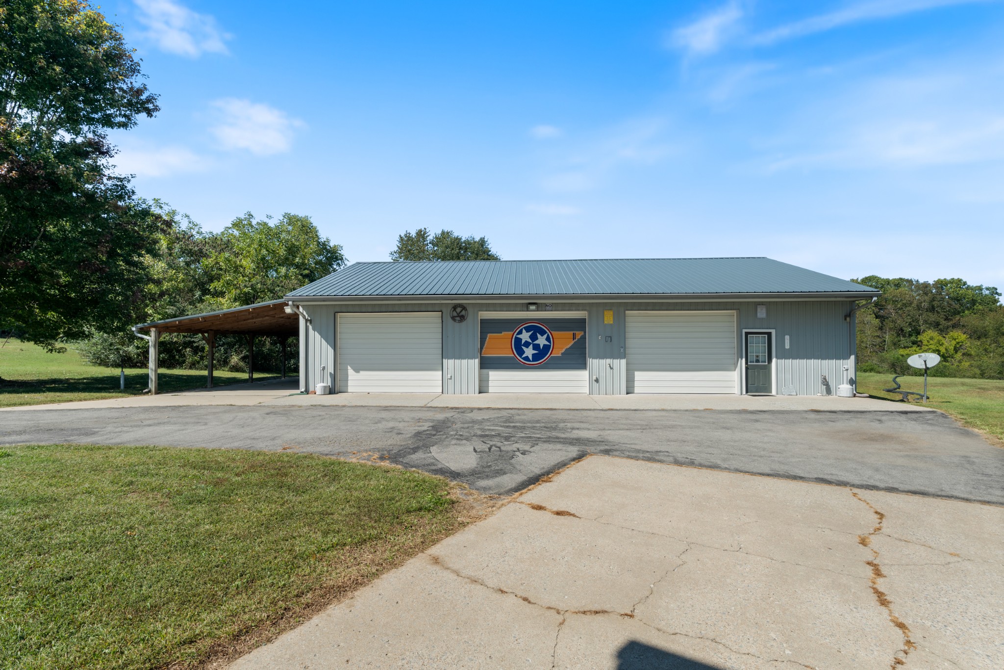 10779 North Tidwell Road Bon Aqua, TN 37025 - Photo 32 of 44 front view of a house with a yard