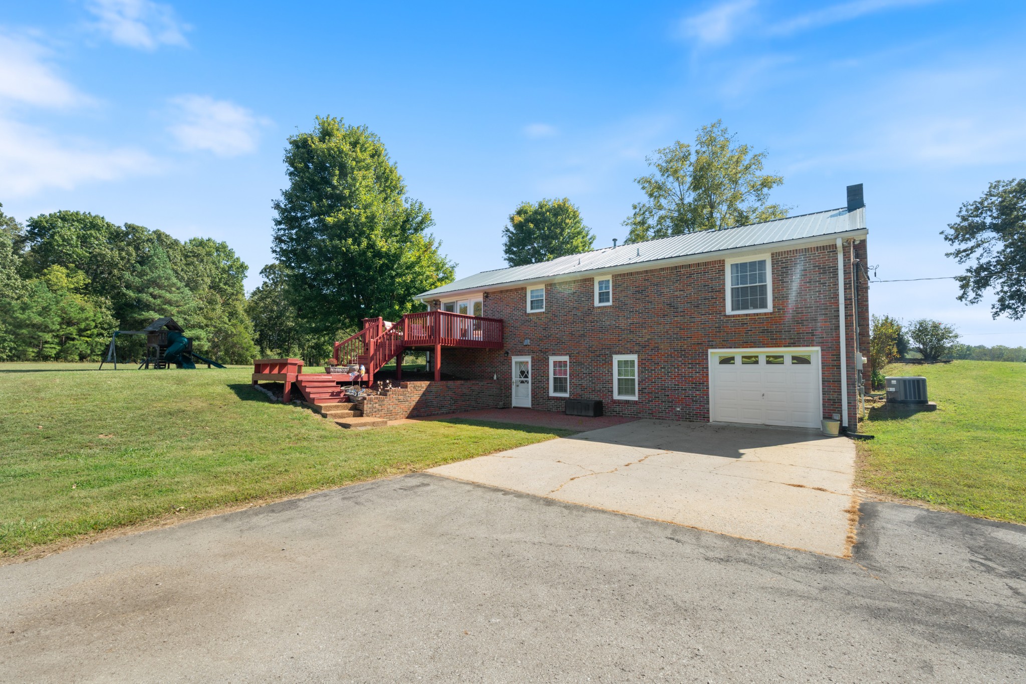 10779 North Tidwell Road Bon Aqua, TN 37025 - Photo 37 of 44 a front view of house with yard and trees in the background