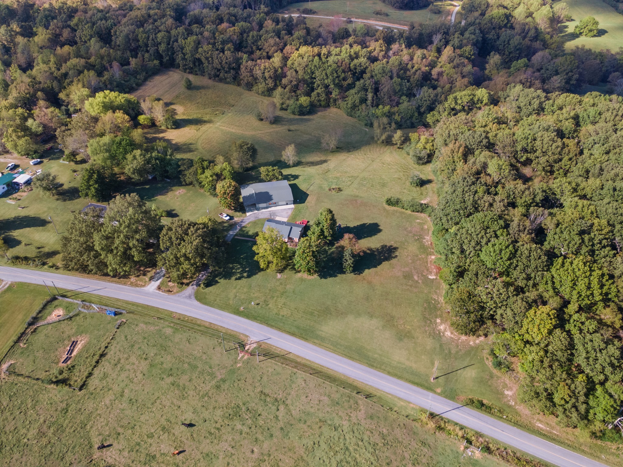 10779 North Tidwell Road Bon Aqua, TN 37025 - Photo 40 of 44 a view of a yard with wooden fence