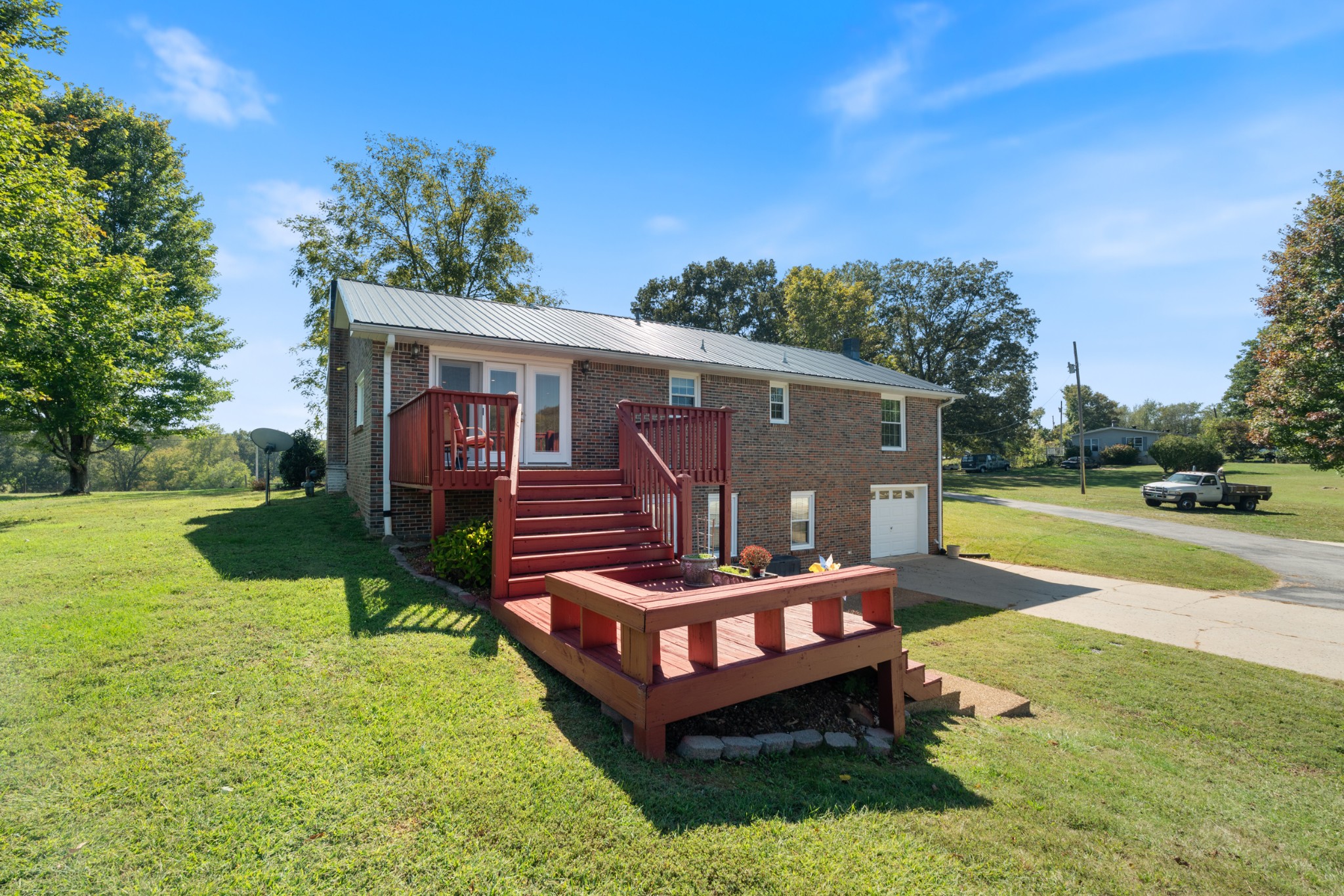 10779 North Tidwell Road Bon Aqua, TN 37025 - Photo 40 of 46 a view of a house with swimming pool and a yard