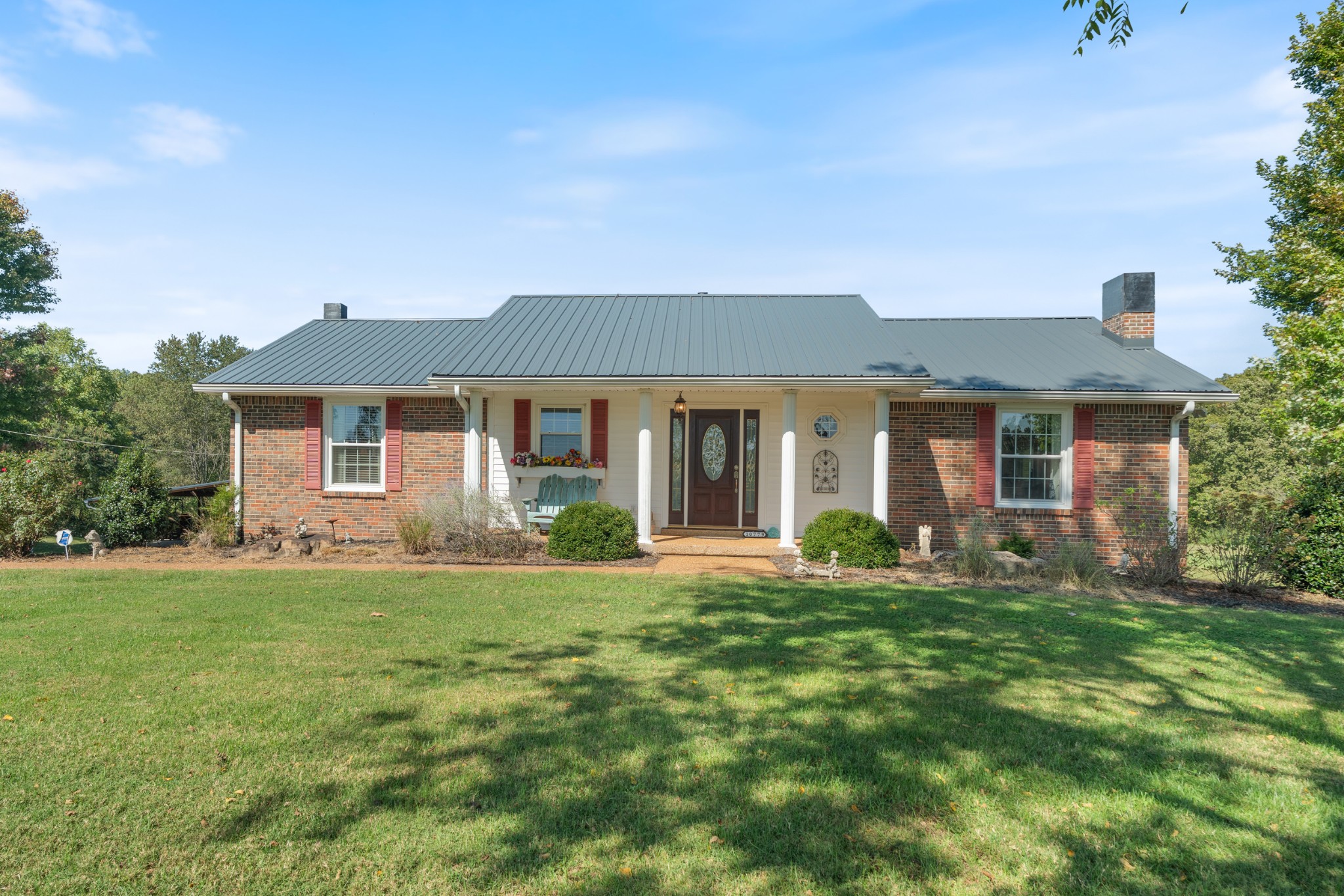 10779 North Tidwell Road Bon Aqua, TN 37025 - Photo 5 of 46 front view of a house with a yard