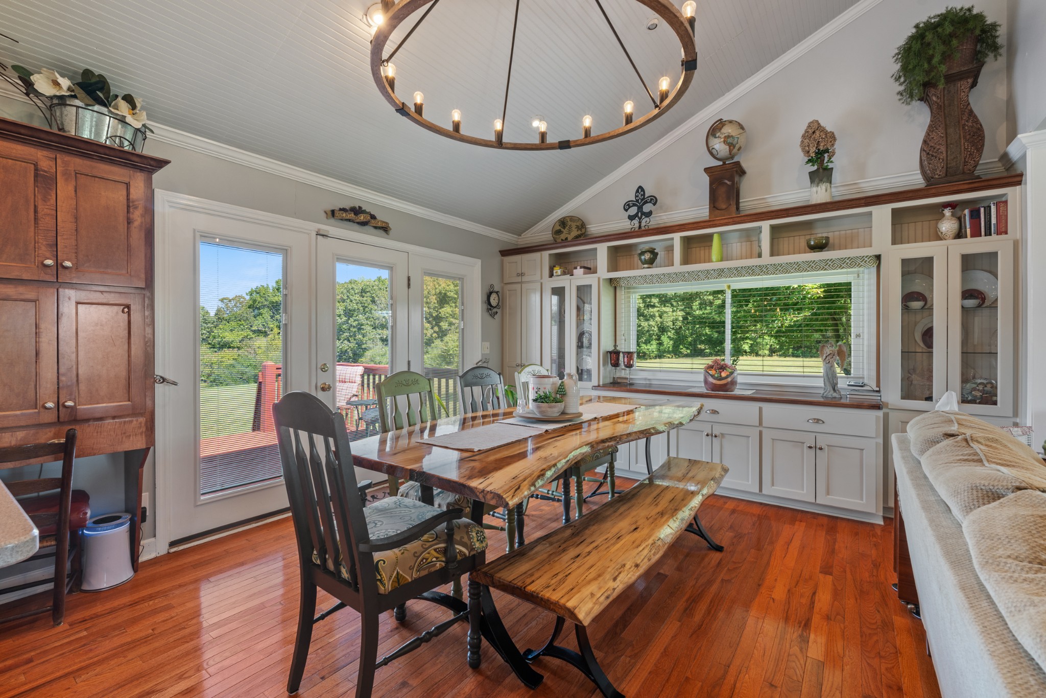 10779 North Tidwell Road Bon Aqua, TN 37025 - Photo 6 of 46 a kitchen with a table chairs stove and cabinets
