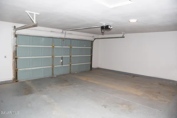 a view of storage and utility room with empty racks