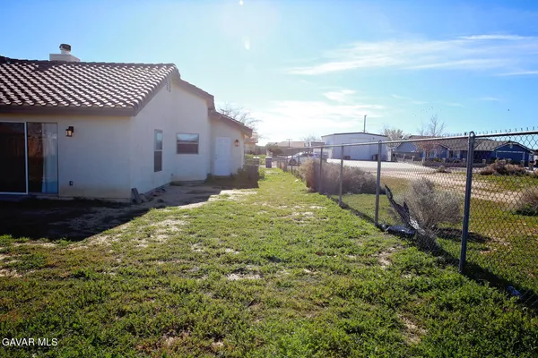 a house view with a backyard space