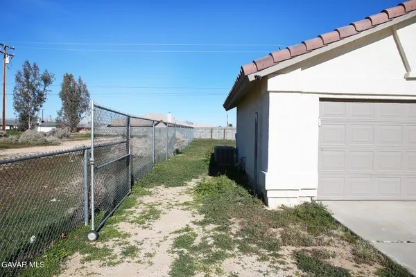 a view of a balcony with yard