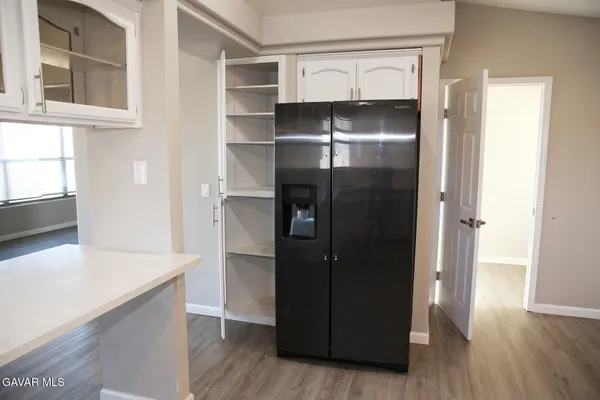 a view of walk in closet with empty racks