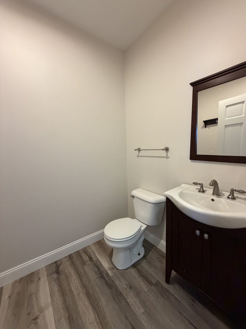 20922 Cattail Road Fulton, IL 61252 - Photo 21 of 30 a bathroom with a toilet a sink and mirror