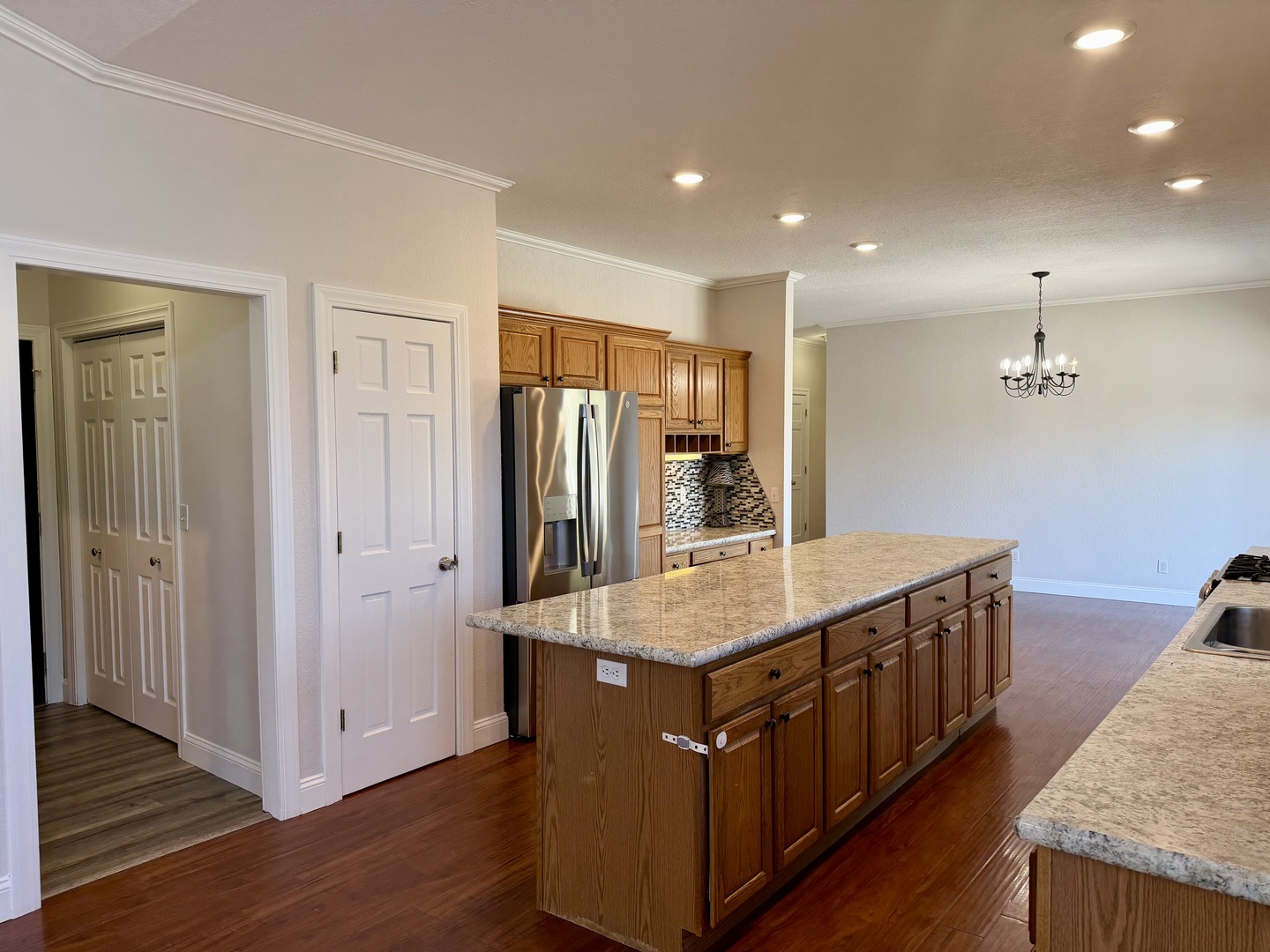 20922 Cattail Road Fulton, IL 61252 - Photo 4 of 30 a kitchen with stainless steel appliances granite countertop a sink a refrigerator and a stove