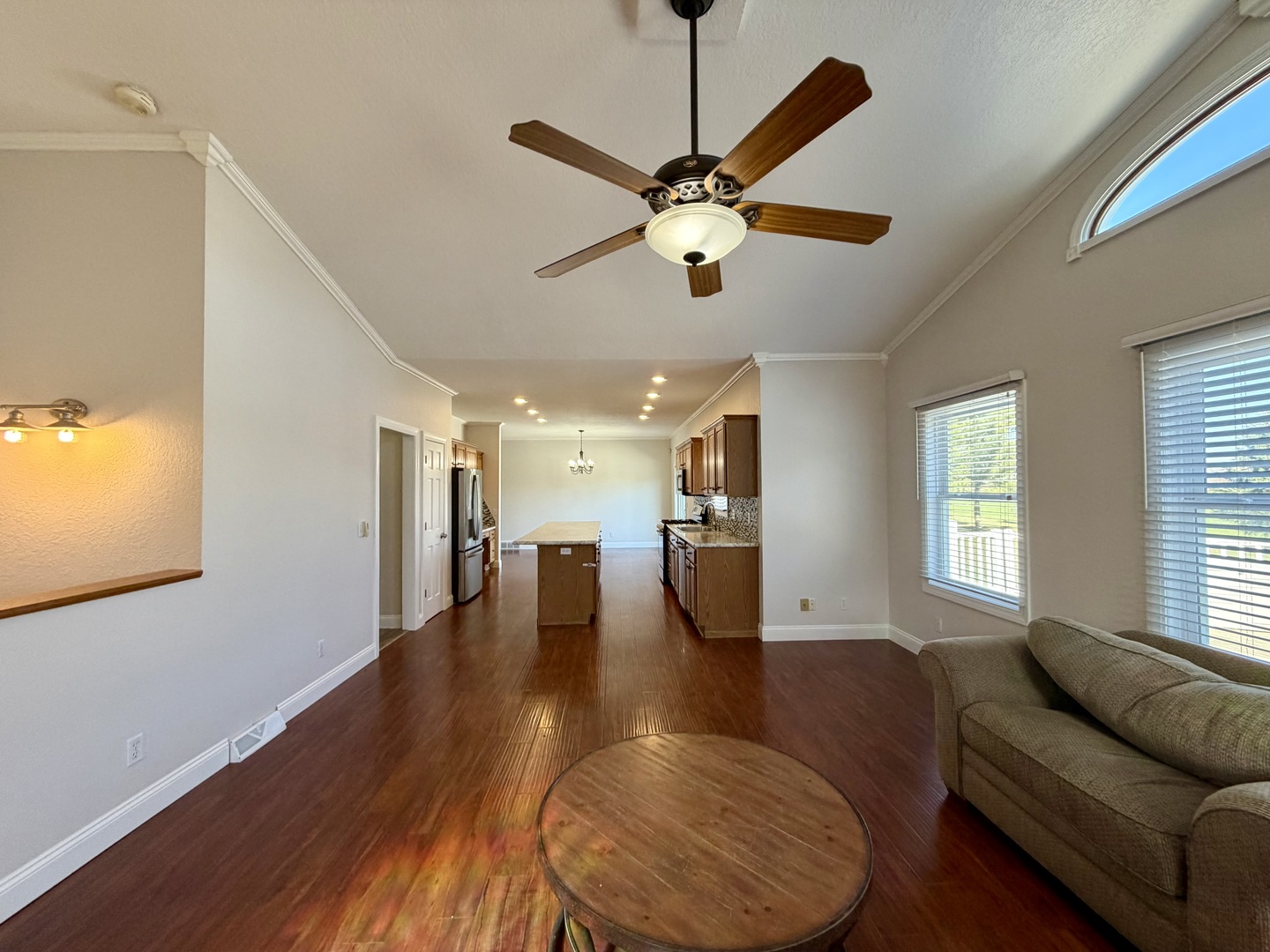 20922 Cattail Road Fulton, IL 61252 - Photo 7 of 30 a living room with couches and kitchen view with wooden floor