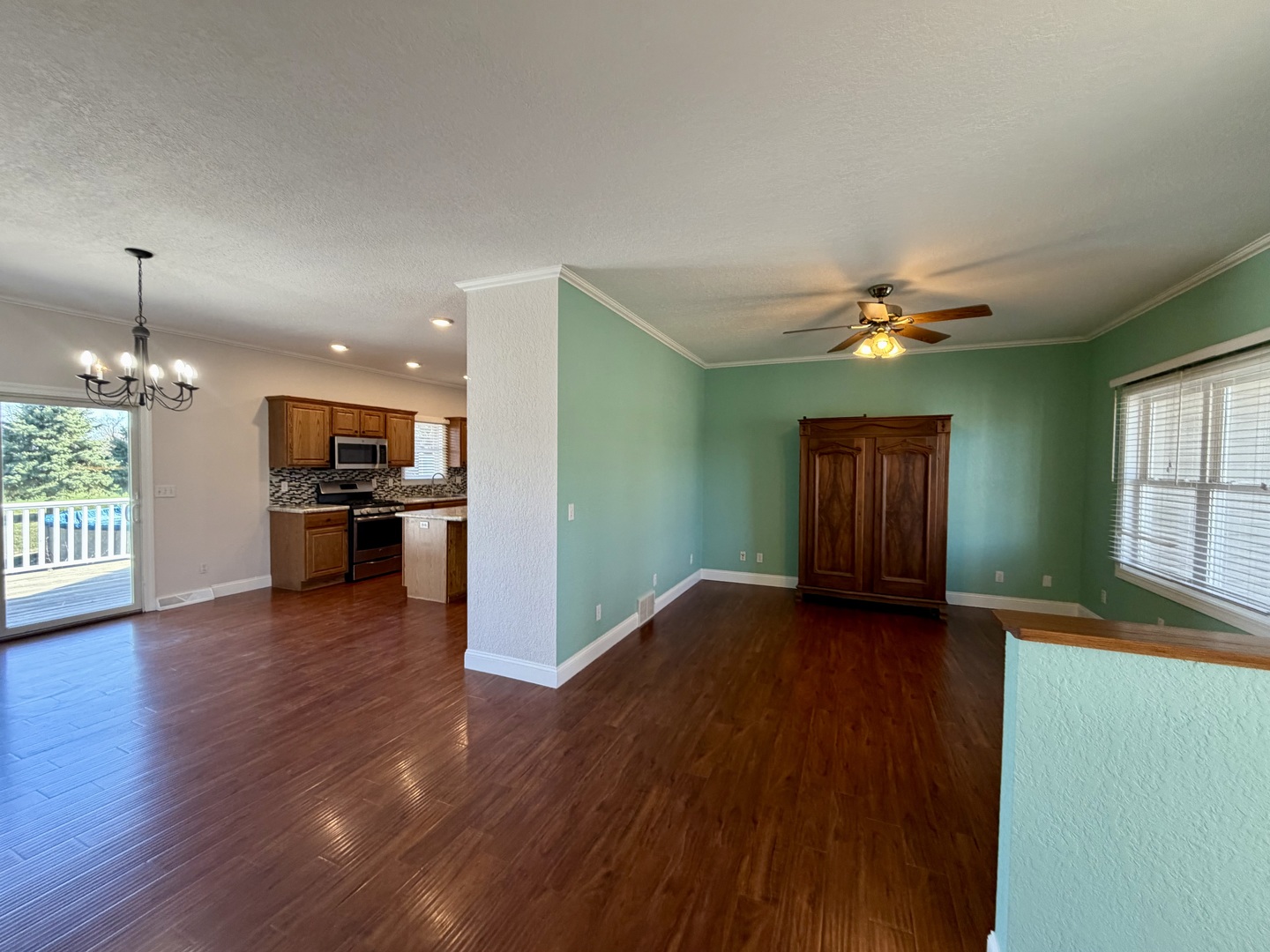 20922 Cattail Road Fulton, IL 61252 - Photo 10 of 30 an empty room with wooden floor and windows