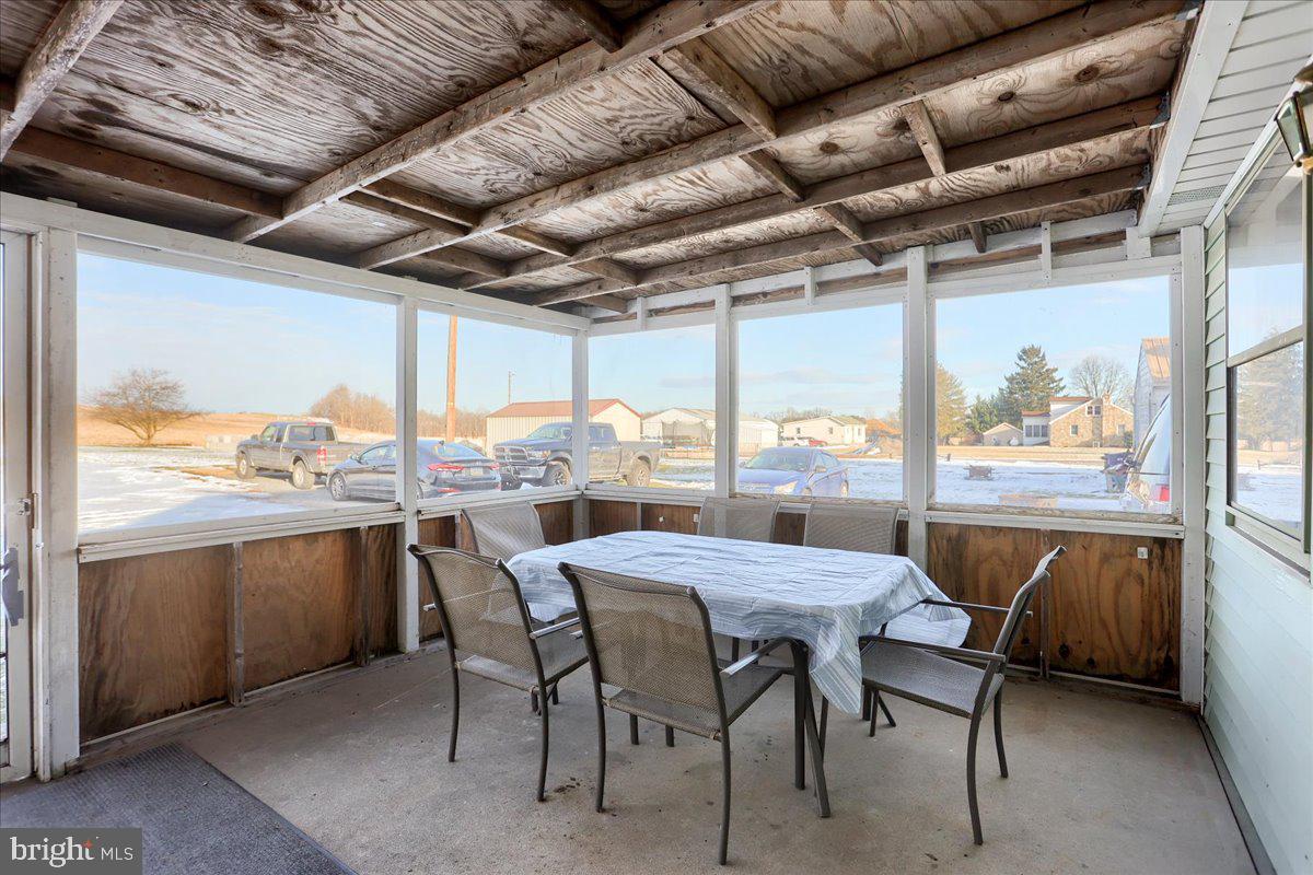 3014 Centennial Road Hanover, PA 17331 - Photo 34 of 50 a view of a dining room with furniture large windows and wooden floor