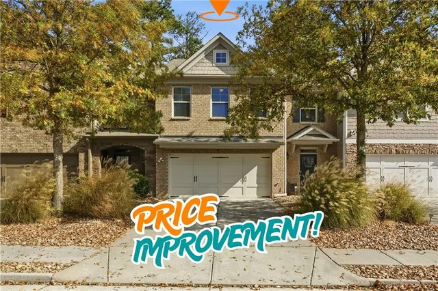 a front view of a house with sign board