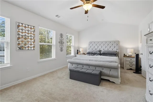 a spacious bathroom with a double vanity sink and a mirror