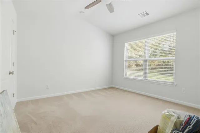 an aerial view of house with swimming pool and a yard