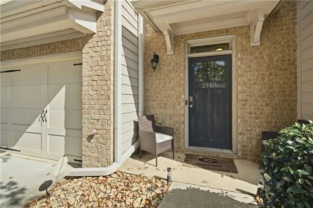 a view of a hallway with seating area and wooden floor