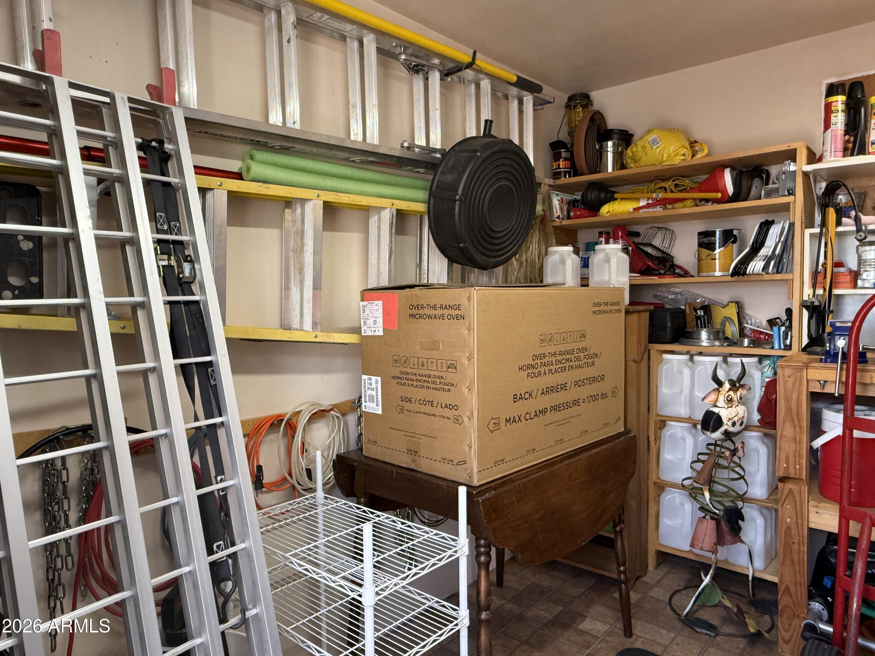 21175 Westward View Road, Unit 241 Congress, AZ 85332 - Photo 37 of 49 Shed interior with Bench (1)