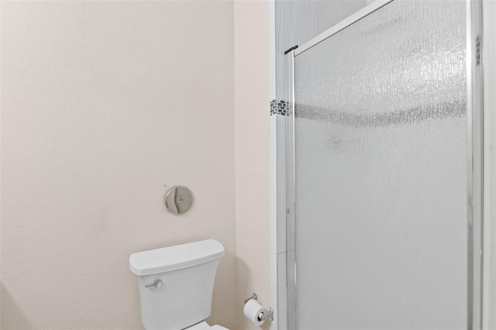 700 West Collins Street Denton, TX 76201 - Photo 8 of 36 Downstairs bathroom also has shower