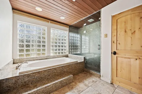 a swimming pool with outdoor seating and yard