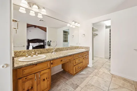 a view of a swimming pool with a patio and a garden