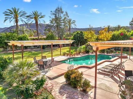 a bedroom with bed and wooden floor