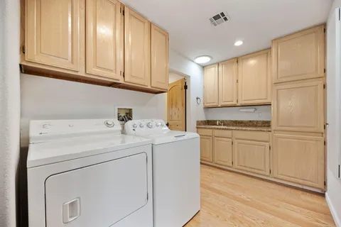 a bedroom with furniture and air hockey table